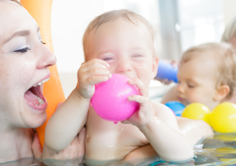 Mothers and babies having fun in the pool