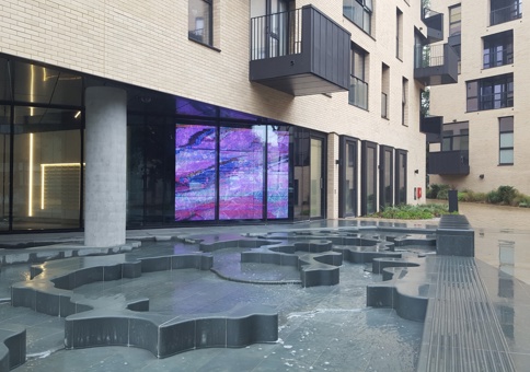 Video screens on the ground floor window to the tower overlooking the saltmarsh pool