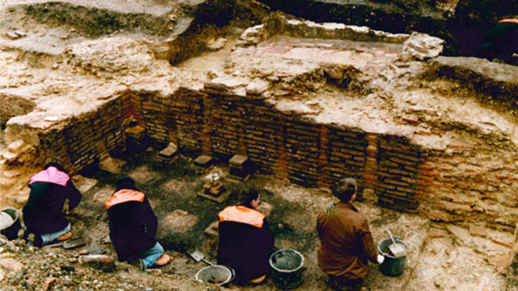 Archaeologists uncovering the heating system of the Roman baths