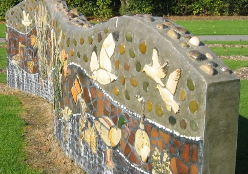 Stone wall with mosaic of local wildlife