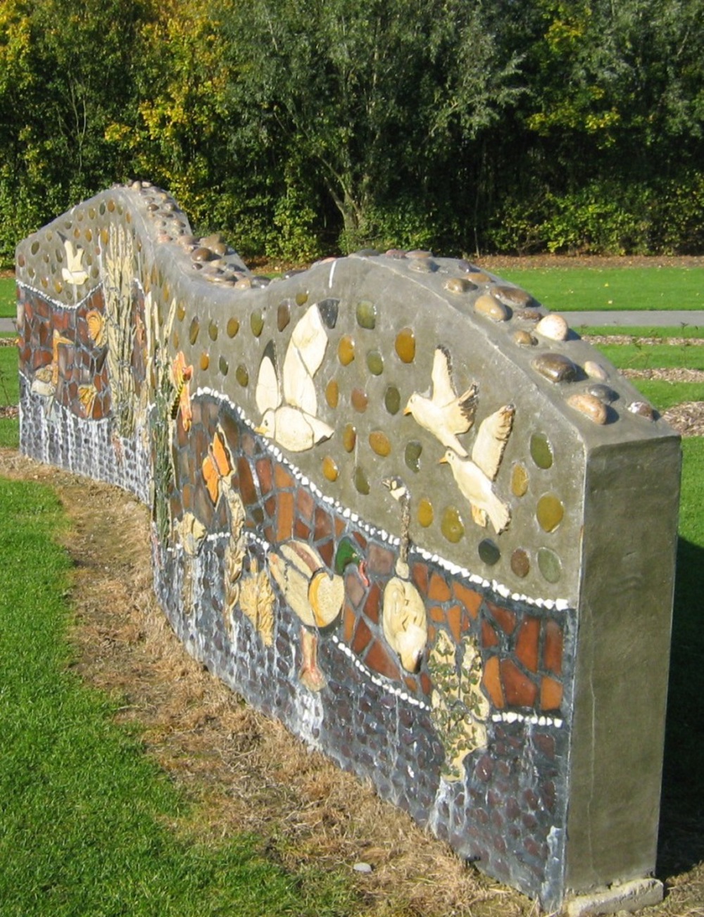 Stone wall with mosaic of local wildlife