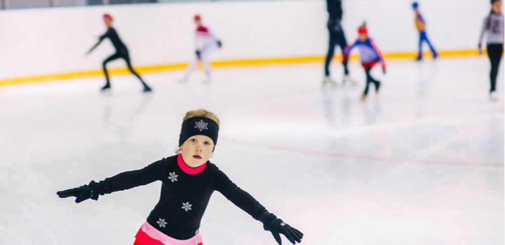 Young children ice skating