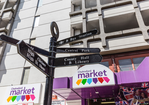 Black fingerpost sign outside Chelmsford Market