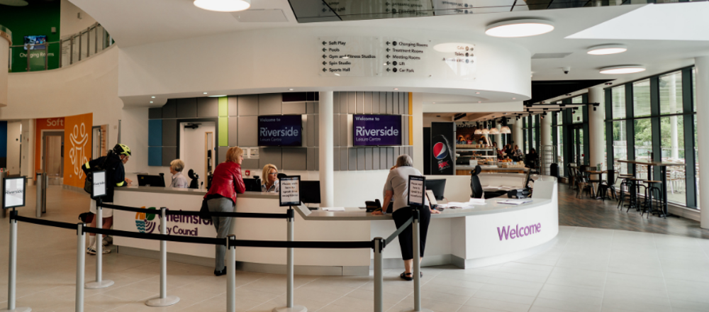 Staff serving customers at Riverside reception