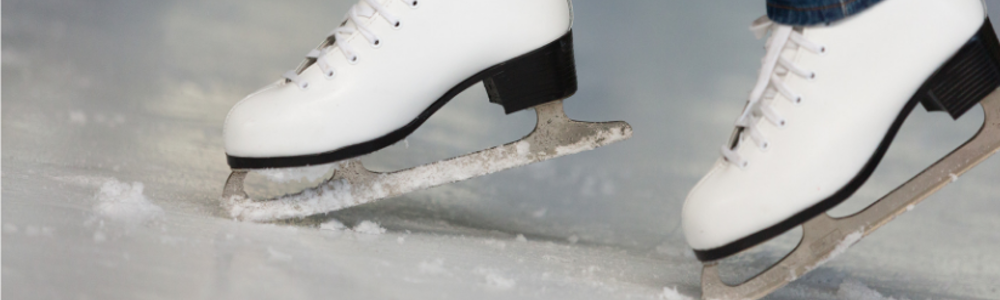 Woman wearing white ice skating boots