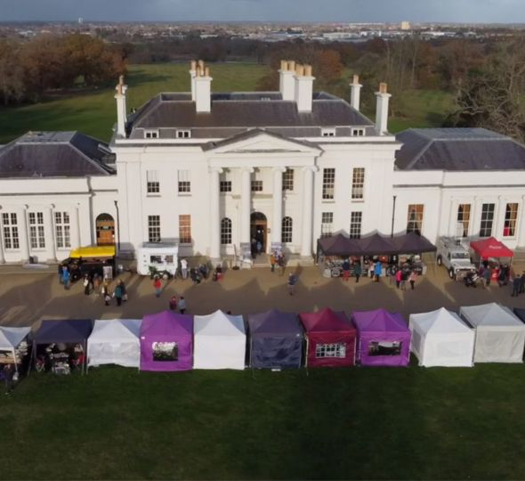 Hylands House with market stalls in front of the house