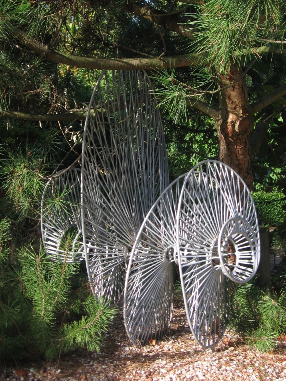 Steel sculpture in a woodland setting