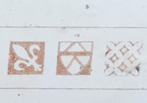 Pleshey Castle text with Fleur-de-lis and other motifs