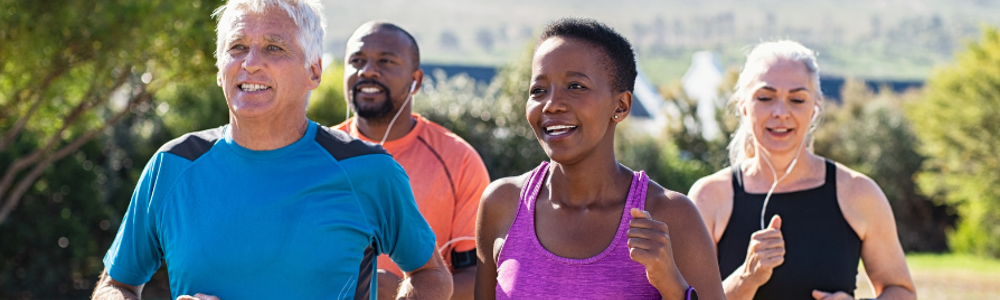 Four people jogging outdoors