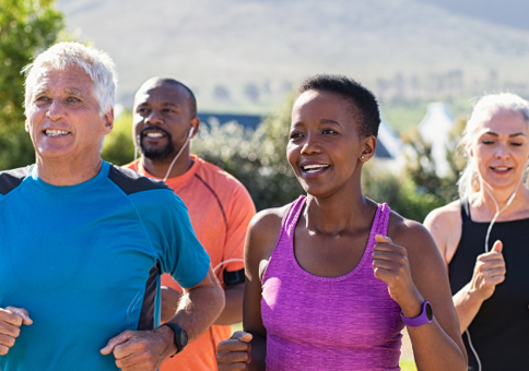 Four people jogging outdoors