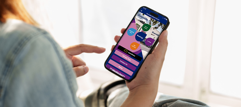Person using our leisure centre app on smartphone