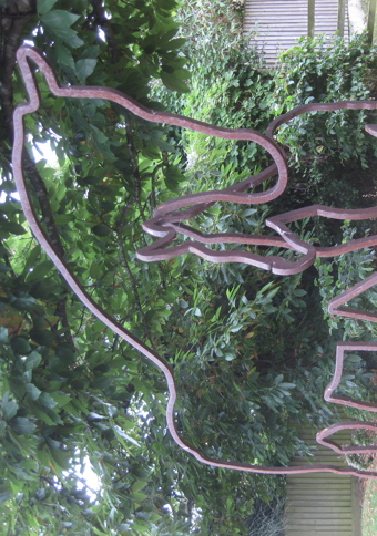 Metal sculpture of outline of horses