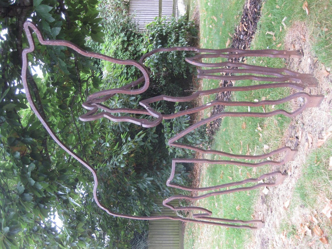 Metal sculpture of outline of horses