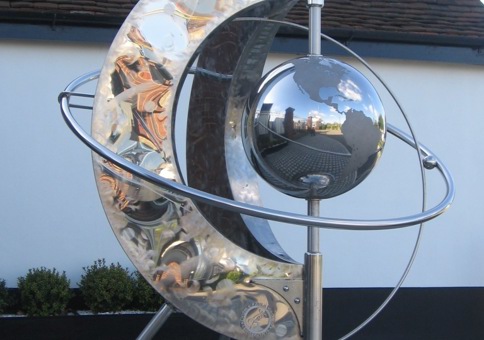 Steel sculpture with a globe in the middle