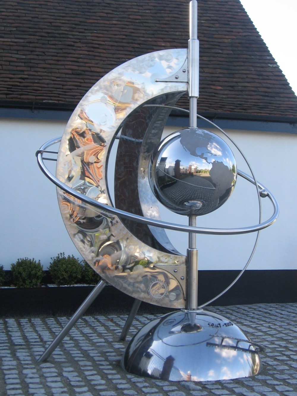 Steel sculpture with a globe in the middle