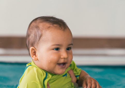 Mother and baby in swimming pool